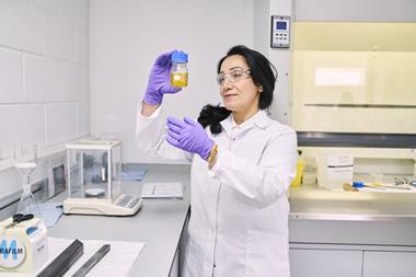 A photo of a woman working in a lab