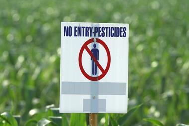 An image showing a pesticides use warning sign