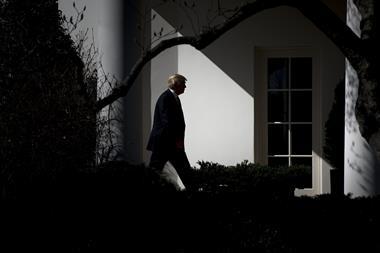 A contrasty image showing the silhouette of Donald Trump