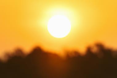 A photograph of the sun glaring in a clear sky