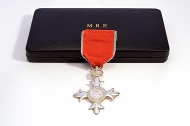 An MBE medal and its presentation box