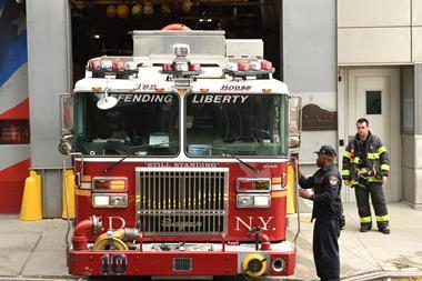 Firefighters and fire truck near the FDNY Ten House on Liberty Steet on lower Manhattan.