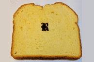 The letter “R” in LIG induced from bread.