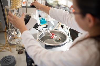 Woman operating rotavap