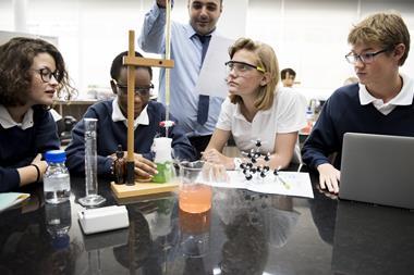 High school students studying chemistry