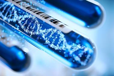 A digital illustration of a DNA molecule in a test tube