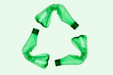 An image showing bottles forming a recycling symbol