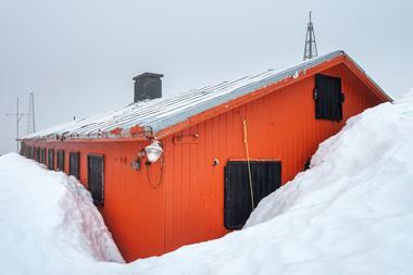 An image showing a house under snow