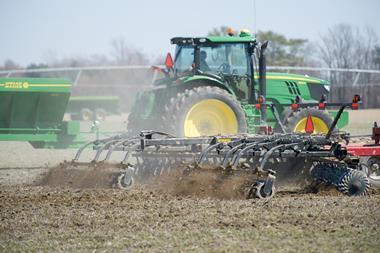 Tractor spreading manure