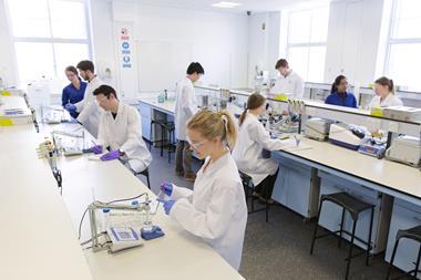 An image showing chemistry students in a laboratory