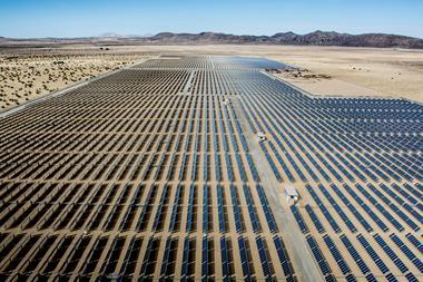 An image showing solar panels in the desert