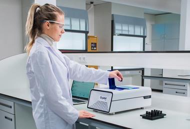Photograph of a researcher using the Technobis Crystal16 in a laboratory