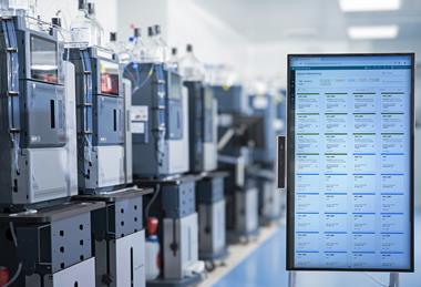 Laboratory with Waters Alliance iS HPLC systems and digital system monitoring display for real-time performance tracking