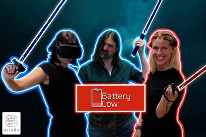 An image showing three people with swords and the Battery Low logo