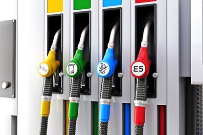 Petrol pumps with labels indicating synthetic fuels