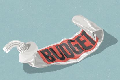 A tube of toothpaste labelled budget that has been squeezed nearly empty