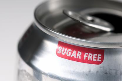 Close up of the rim of an open can of soft drink which has a label which says Sugar Free