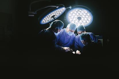 Several surgeons performing an operation