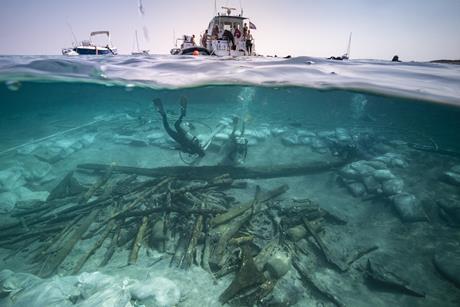 Half underwater shot of ship and Roman shipwreck