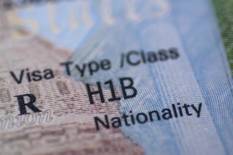 A close up of a H1B visa in a passport