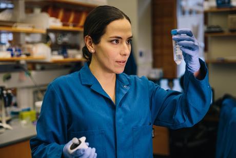 Markita Landry in the laboratory looking at a sample