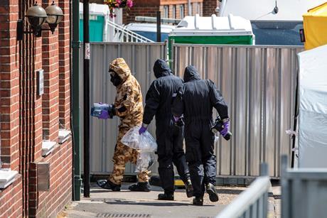 Emergency workers in protective suits search around John Baker House Sanctuary Supported Living