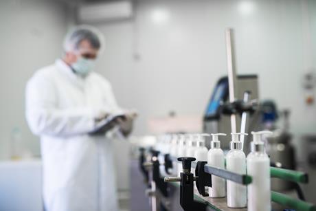 Man checking liquid soaps