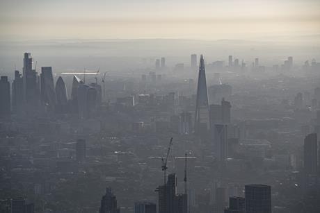 An aerial photo of a very hazy central London near sunset