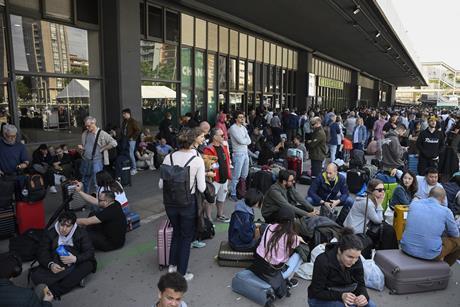People outside Barcelona Sant rail station during a massive power cut