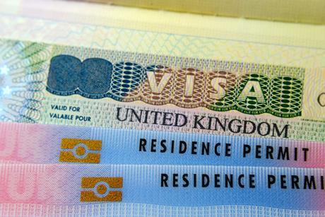 A UK Visa and two residence permit cards