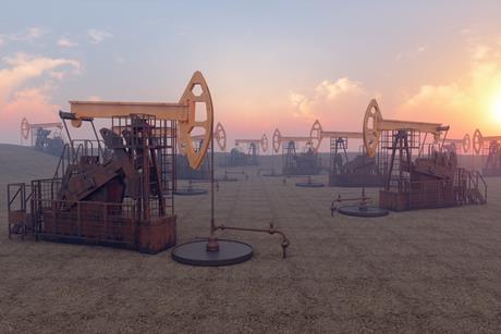 Pumpjacks in an oilfield at sunset
