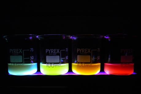 colourful polymer nanoparticles in beakers