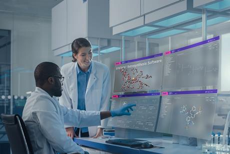 Lab with two scientists using SYNTHIA software on four futuristic projection screens