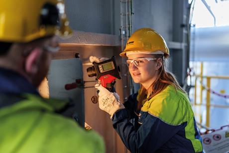 A BASF employee inspects the electrical cracker furnace