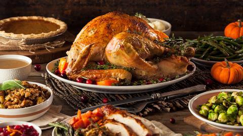 Thanksgiving dinner spread with a roast turkey