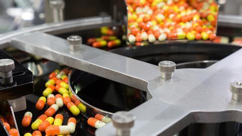Medicine capsules in a factory production line