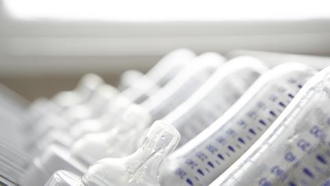 A photo of a line of babies' bottles and teats