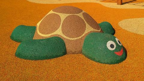 An image showing the figure of a turtle on the playground made of soft rubber crumbs