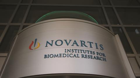 Novartis signage at the Institute for BioMedical Research building in Cambridge, Massachusetts, US
