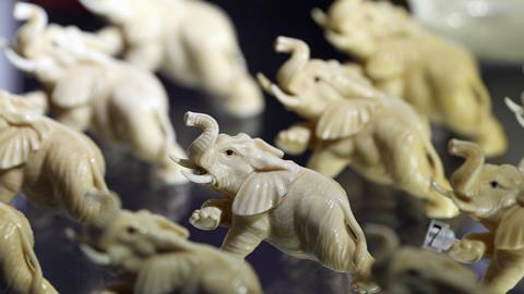 A photo of elephant figurines made of ivory