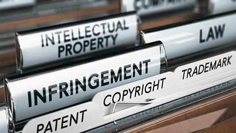 Illustration of a folder, focus on a tab with the word infringement. 