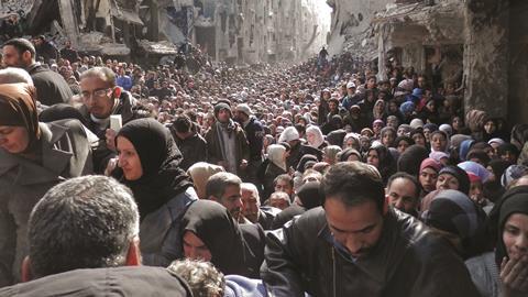 Residents in the Yarmouk refugee camp in Damascus, Syria - Hero