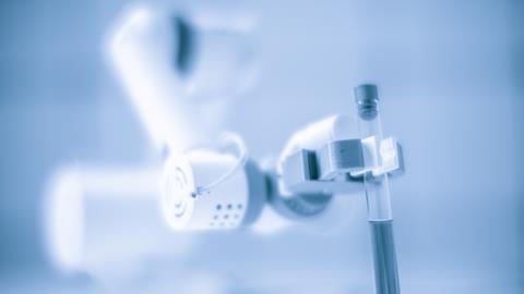 Robotic arm holding test tube