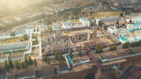 An image showing a chemical plant photographed with a tilt-shift lens, which gives the impression that the viewer is looking at a miniature plant
