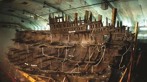 The hull of the Mary Rose, being preserved in a museum