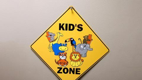 An image showing a kid's zone warning sign