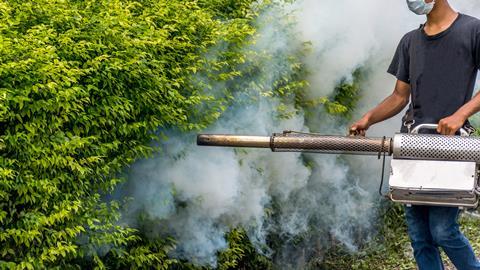 Man spraying DDT mosquito control 