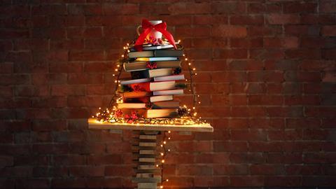 A Christmas tree structure made from a pile of books