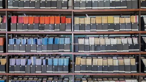 Shelves with old scientific journals in a library