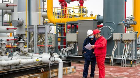 Men inspecting chemical plant